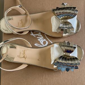 christian louboutin gold sandals.